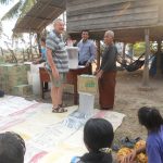 Tex Gowing (vol) donating water filters